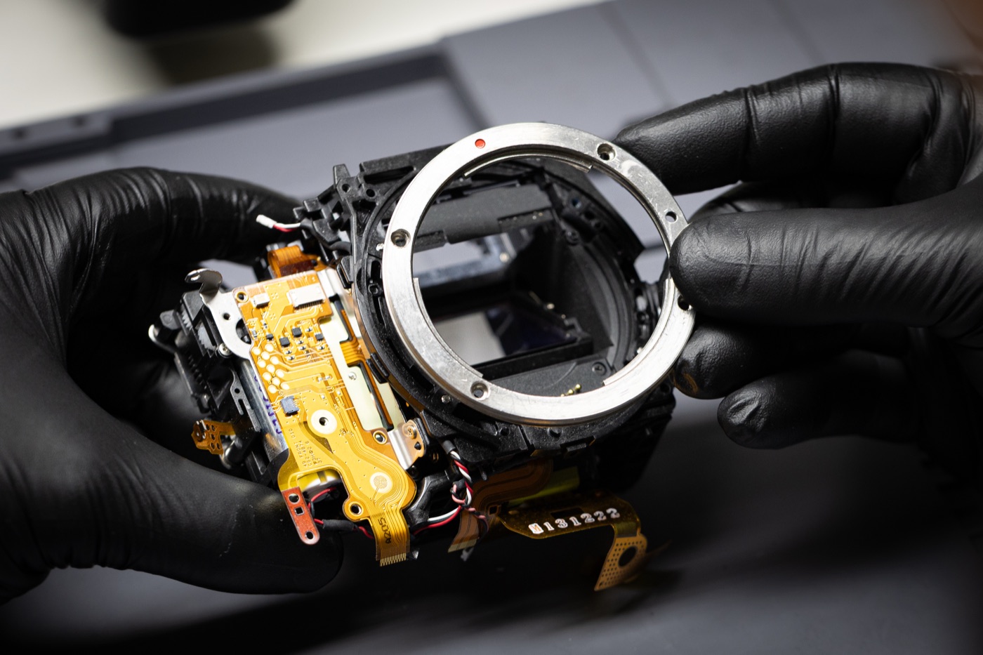 Camera body opened on a technician workbench