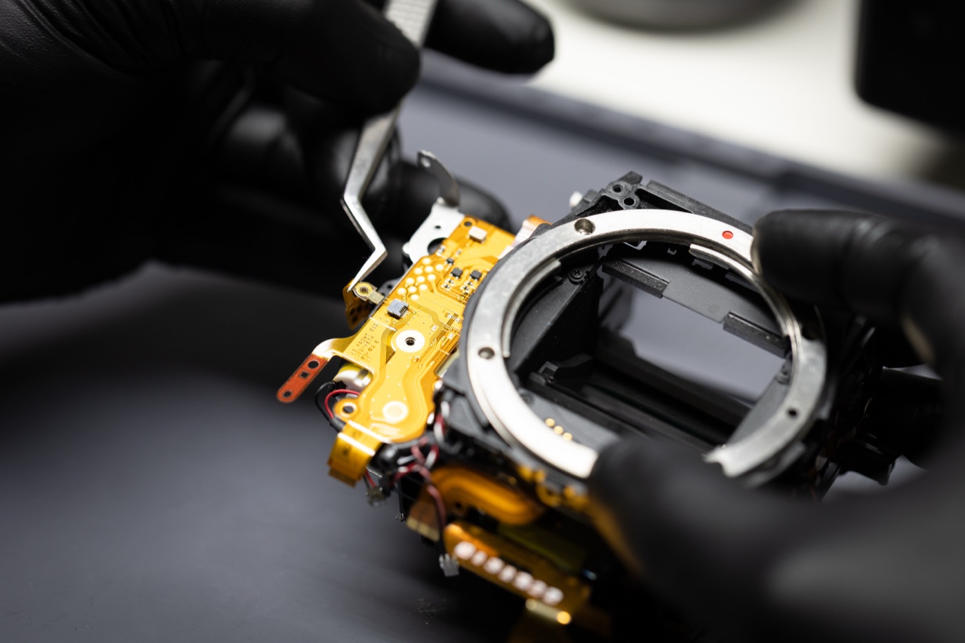MPC technician servicing camera gear in-house